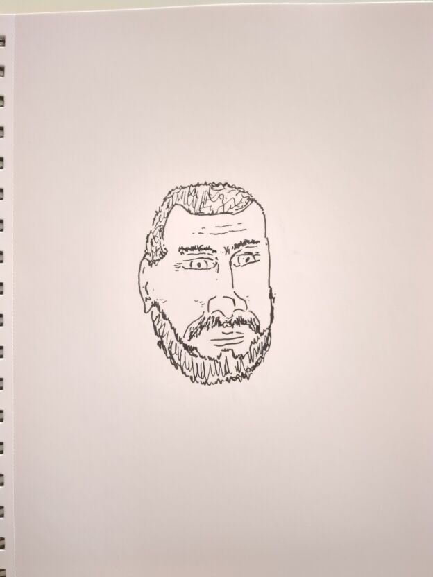 An ink drawing of a very bad self portrait of a bearded man.
