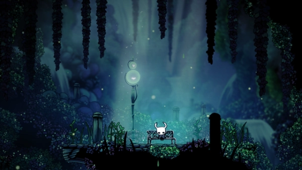 Screenshot from Hollow Knight: the knight sitting on a bench