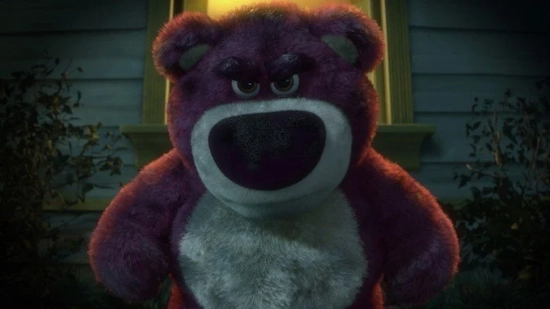 A photo of Lots-o’-Huggin’ Bear from Toy Story 3. He is backlit and angry.