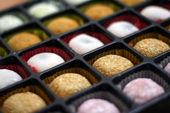 Pieces of mochi in a grid-shaped box