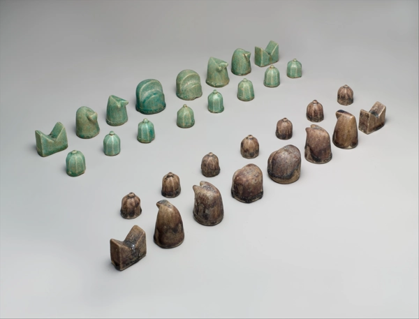 Ancient chess set from Iran. One side is green and the other is brown